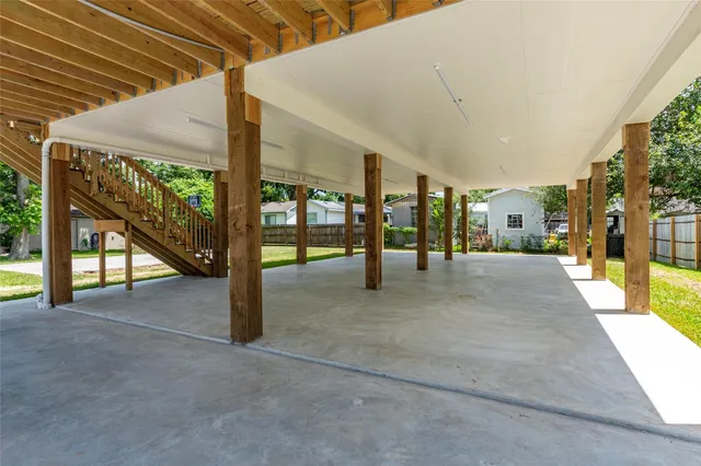 a view of a house with a yard and sitting area