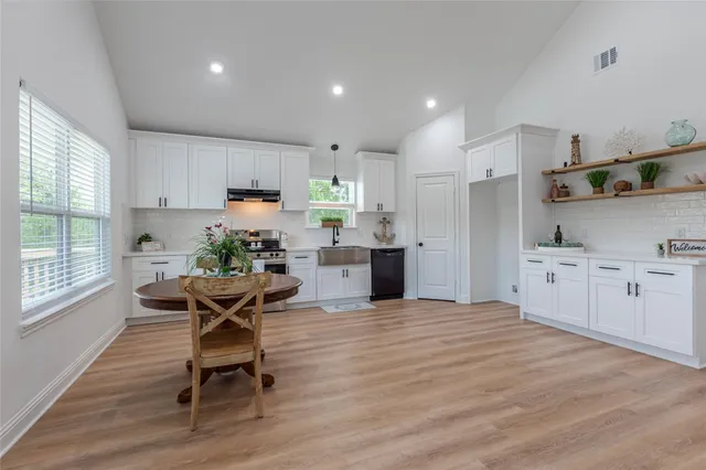 a living room with furniture and a table