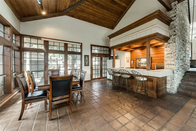 a view of a house with pool and a yard