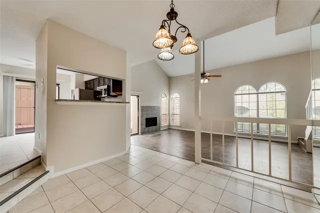a view of a livingroom with furniture wooden floor and windows