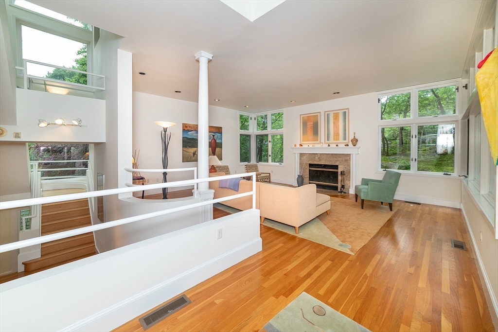 50 Bellingham Road Brookline, MA 02467 - Photo 11 of 31 a living room with furniture large window and a fireplace