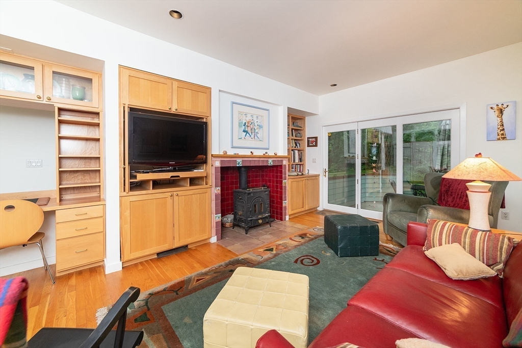 50 Bellingham Road Brookline, MA 02467 - Photo 14 of 31 a living room with furniture and a flat screen tv