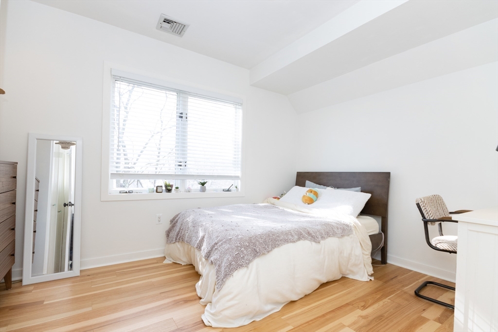 50 Bellingham Road Brookline, MA 02467 - Photo 17 of 31 a bedroom with a bed and a window