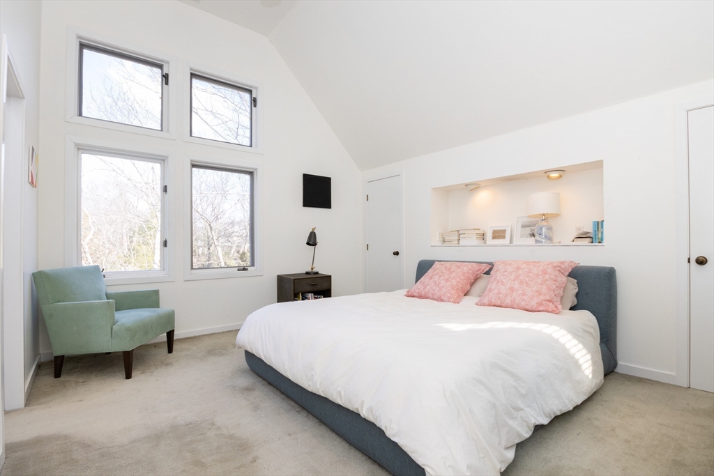 50 Bellingham Road Brookline, MA 02467 - Photo 18 of 31 a bedroom with a bed a couch and a window