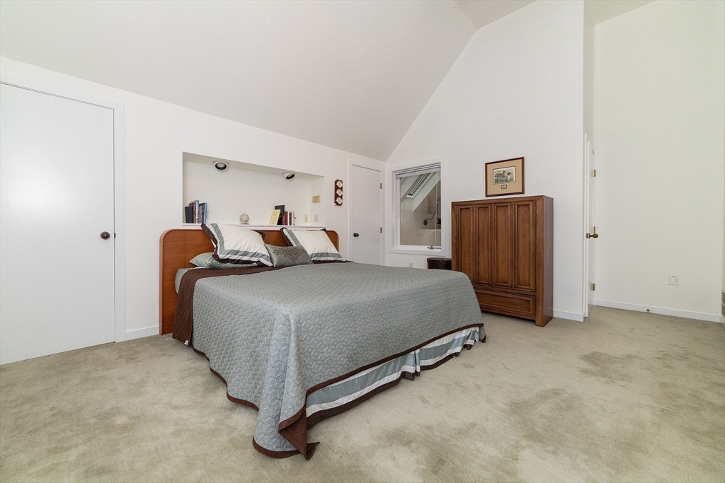 50 Bellingham Road Brookline, MA 02467 - Photo 23 of 31 a bedroom with a bed and a refrigerator