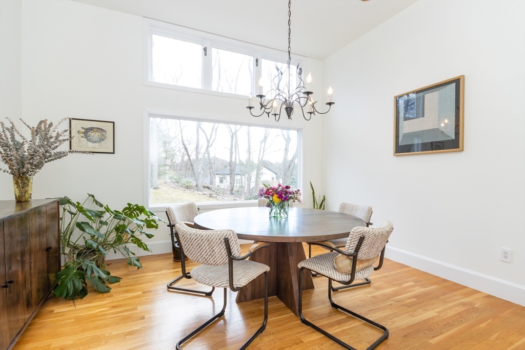 50 Bellingham Road Brookline, MA 02467 - Photo 7 of 31 a view of a dining room with furniture window and wooden floor