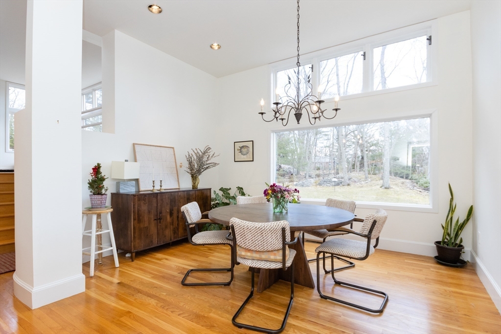 50 Bellingham Road Brookline, MA 02467 - Photo 8 of 31 a living room with furniture and a chandelier