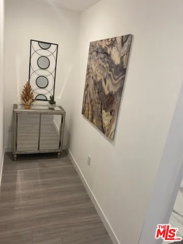 a view of a hallway with stairs