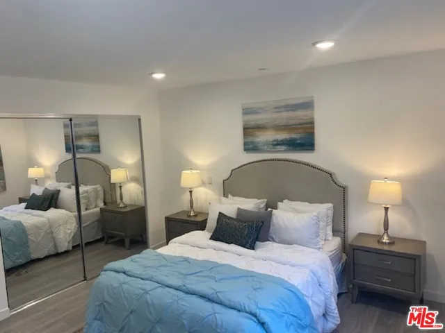 a bedroom with bed and a lamp