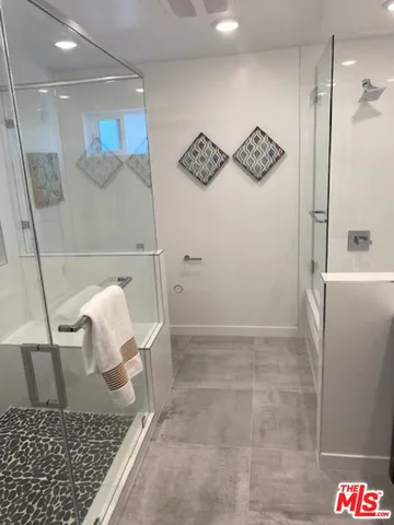 a bathroom with a sink and a shower