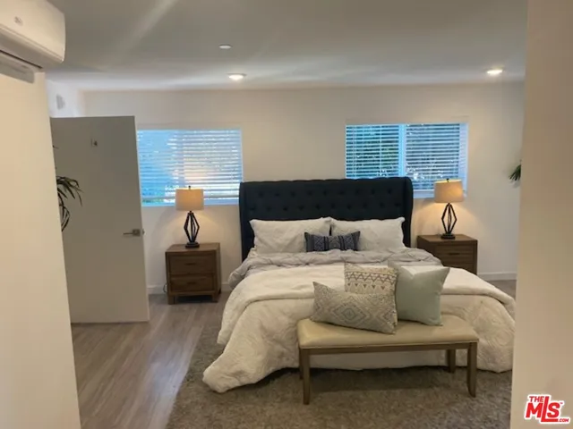 a bed room with a bed and a couch