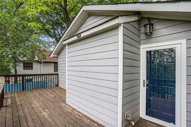 a view of a house with wooden fence