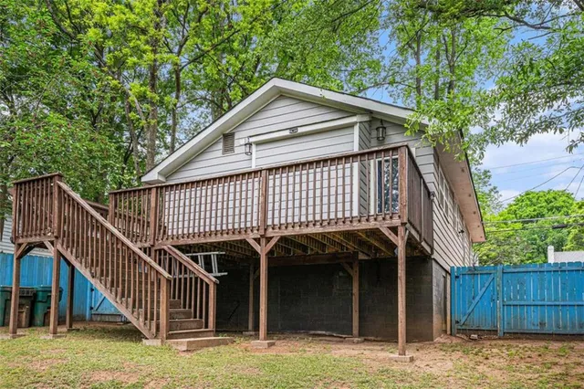 a swimming pool with wooden fence