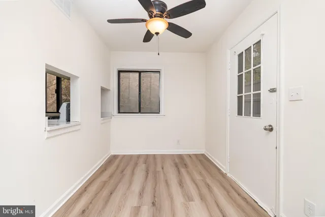 a view of an empty room with a window