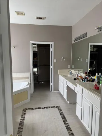 a kitchen with a refrigerator and a sink