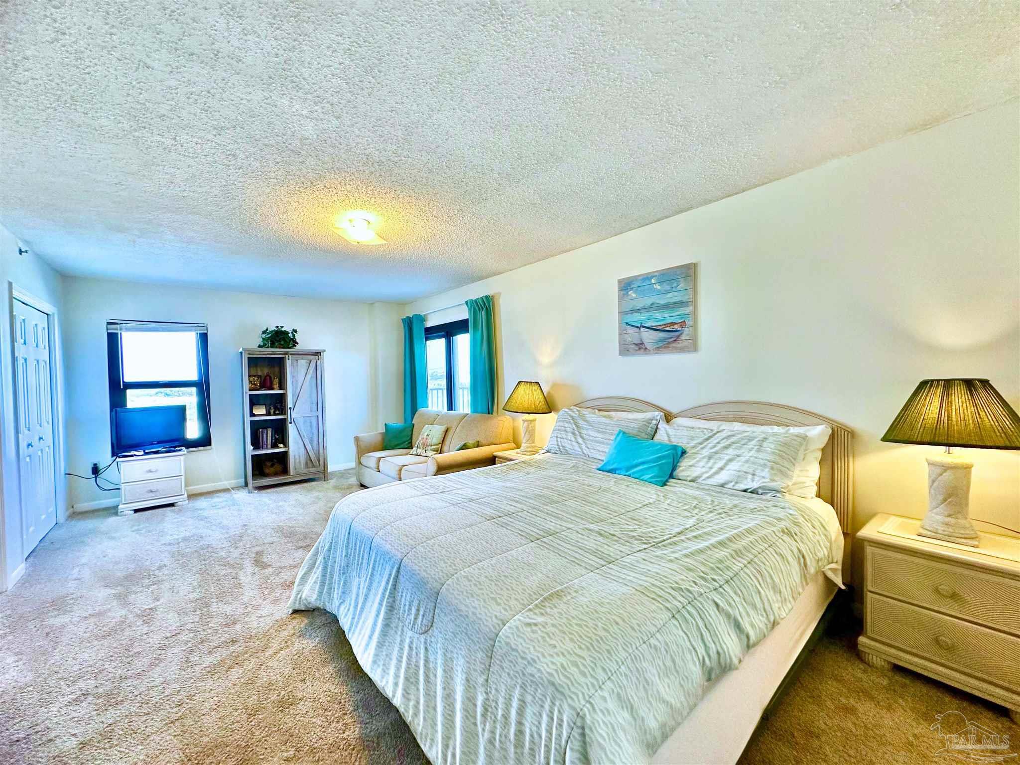 13817 Perdido Key Drive, Unit 204 Pensacola, FL 32507 - Photo 11 of 27 a bedroom with bed and window