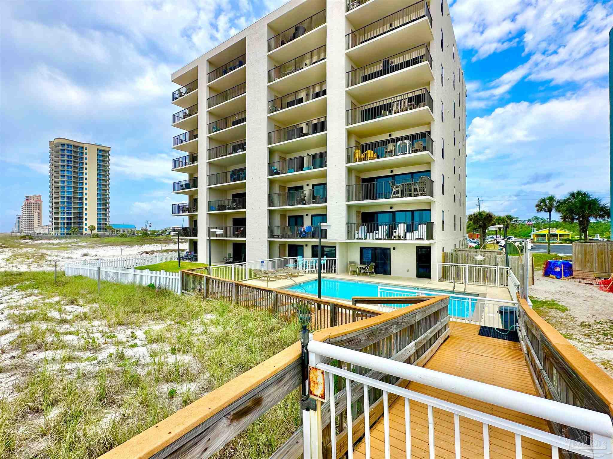 13817 Perdido Key Drive, Unit 204 Pensacola, FL 32507 - Photo 25 of 27 a view of an ocean with swimming pool