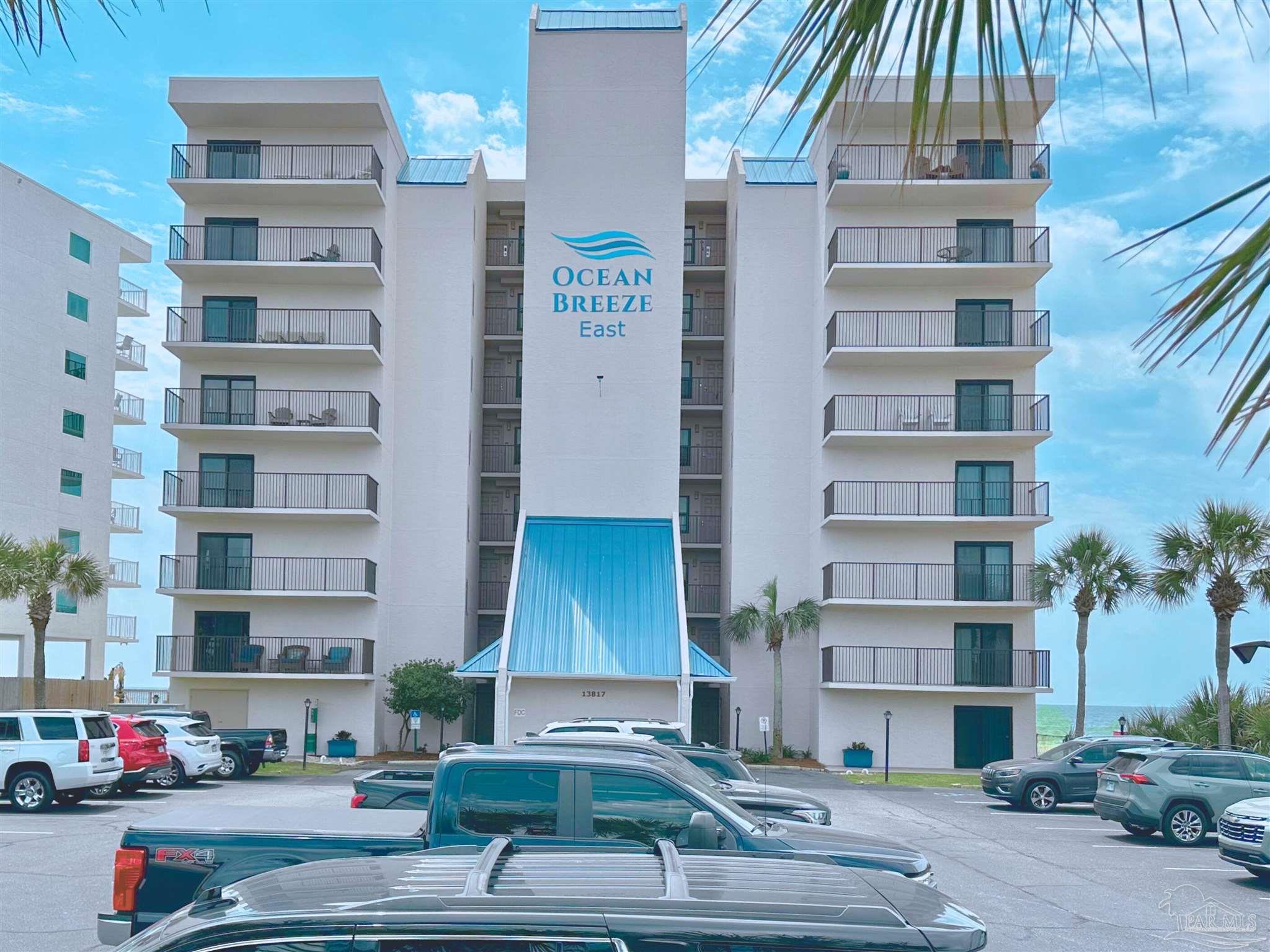 13817 Perdido Key Drive, Unit 204 Pensacola, FL 32507 - Photo 27 of 27 a cars parked in front of a building