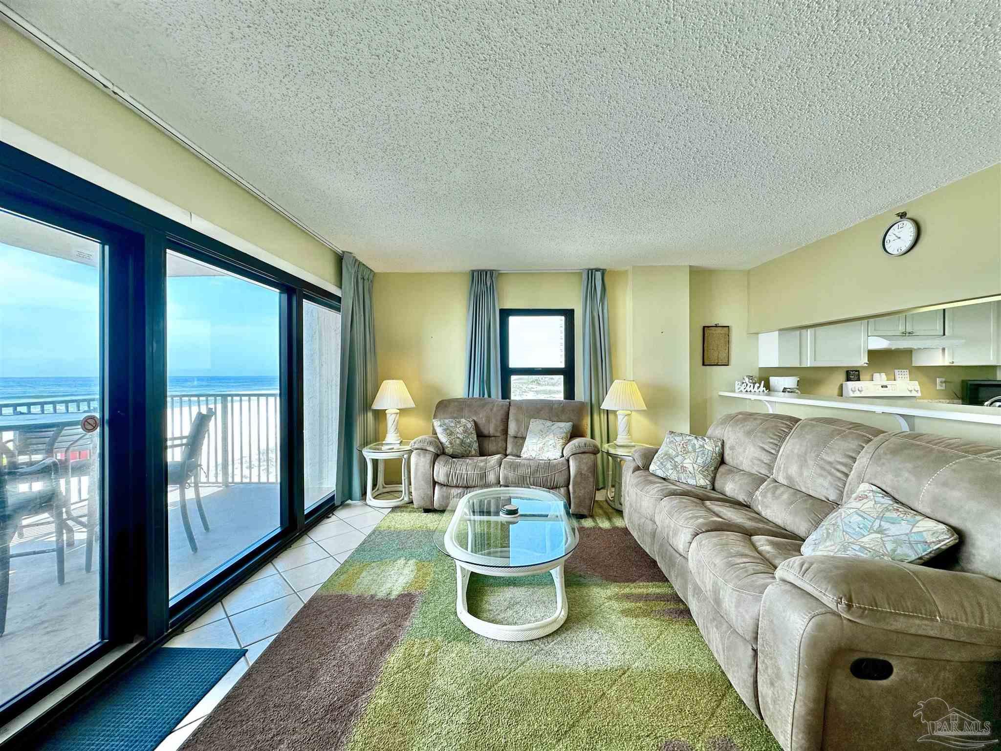 13817 Perdido Key Drive, Unit 204 Pensacola, FL 32507 - Photo 7 of 27 a living room with furniture and a large window