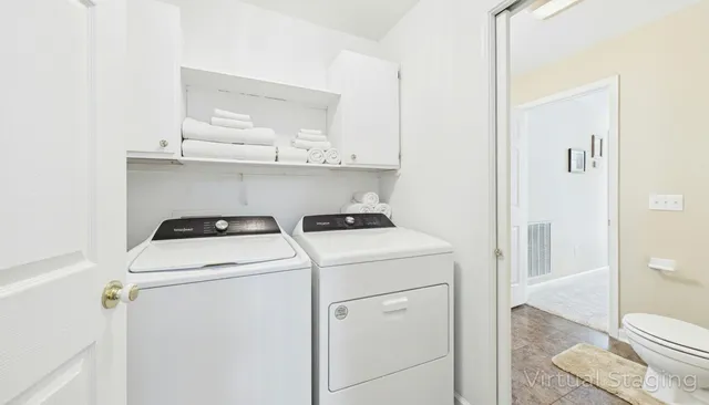a utility room with dryer and washer