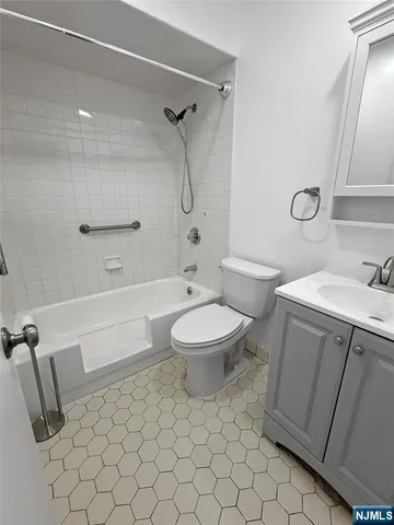 a bathroom with a toilet sink and shower