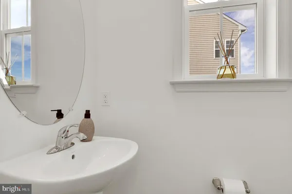 a bathroom with a sink and a window