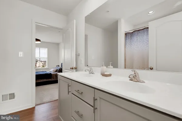 a en suite bathroom with a sink and a mirror