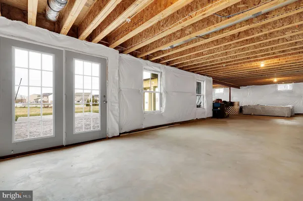a view of an empty room with a fireplace