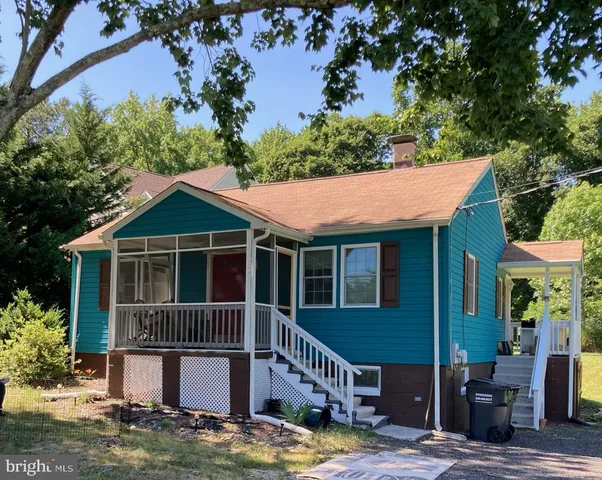 aerial view of a house with a yard