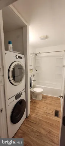 a bathroom with a sink and a washer dryer