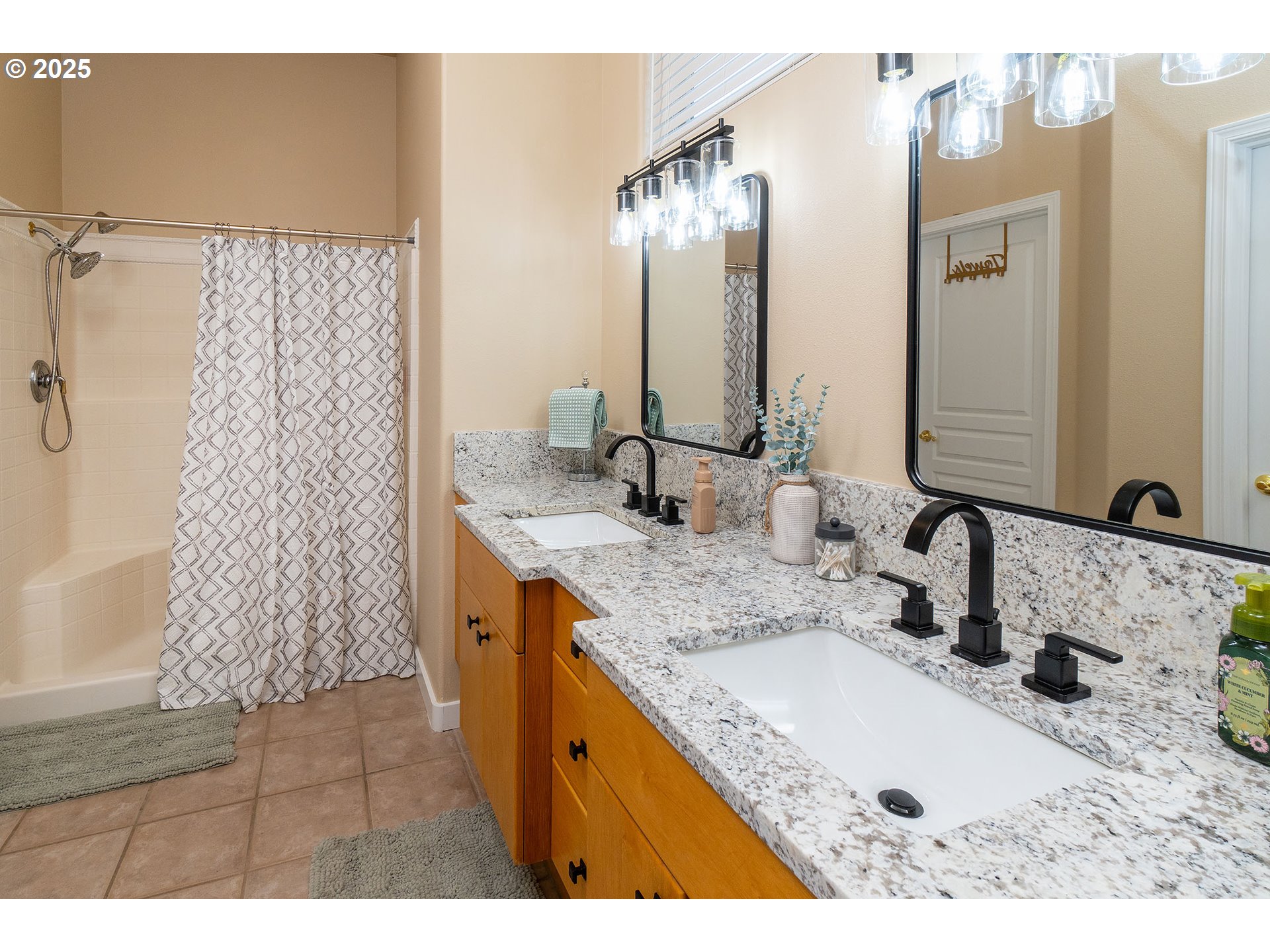 7986 Little Falls Court Redmond, OR 97756 - Photo 11 of 32 a bathroom with a granite countertop sink and a mirror