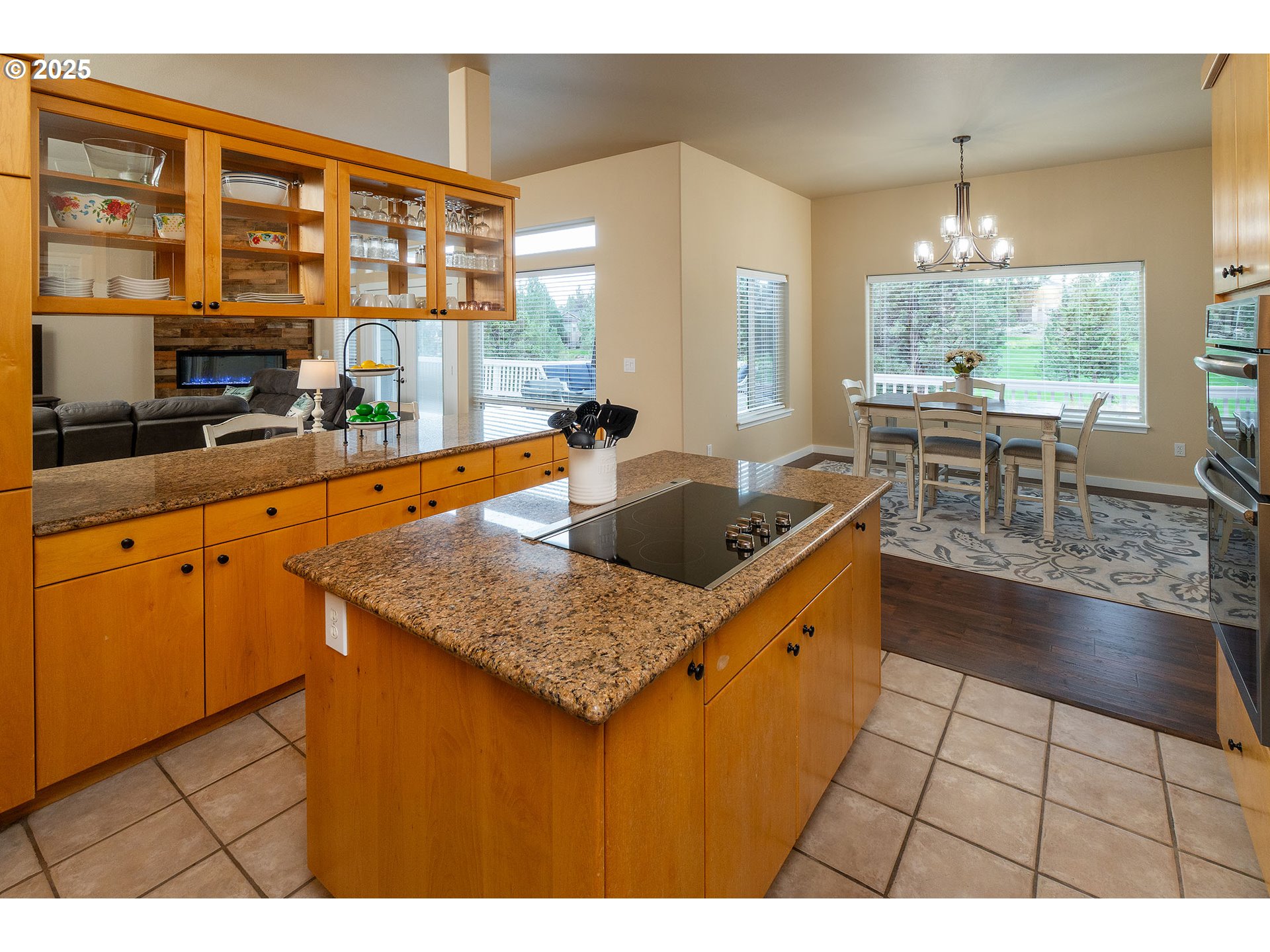 7986 Little Falls Court Redmond, OR 97756 - Photo 14 of 32 a kitchen with granite countertop a sink and a stove