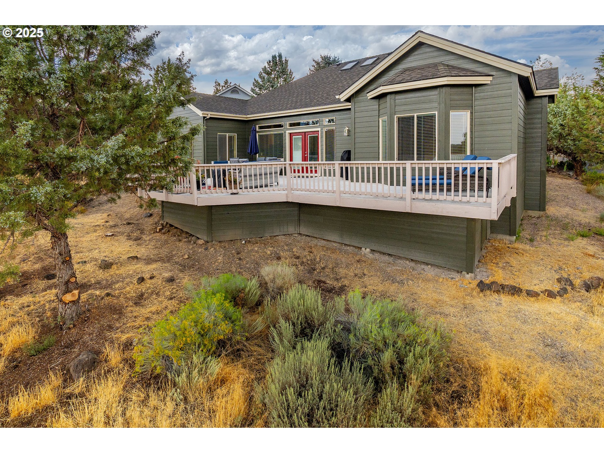 7986 Little Falls Court Redmond, OR 97756 - Photo 18 of 32 a view of house with yard and sitting area