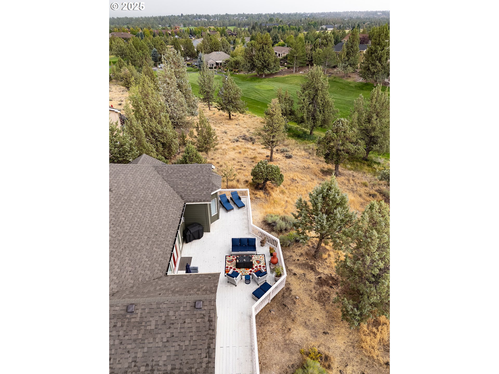 7986 Little Falls Court Redmond, OR 97756 - Photo 29 of 32 an aerial view of a house with a yard and lake view