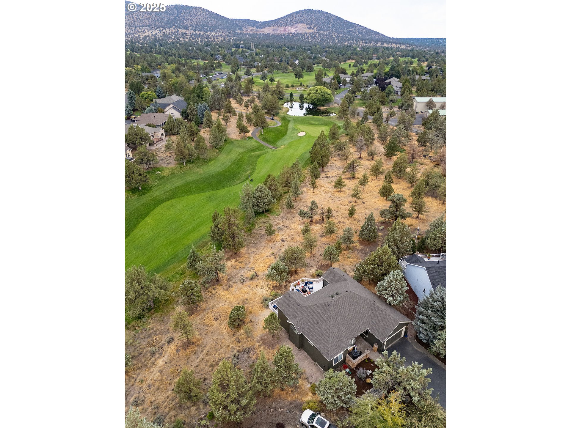 7986 Little Falls Court Redmond, OR 97756 - Photo 30 of 32 a view of a city with tall trees