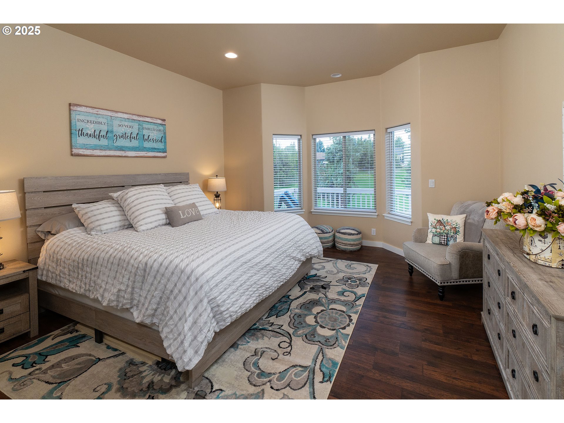 7986 Little Falls Court Redmond, OR 97756 - Photo 10 of 32 a bedroom with a bed and a large window