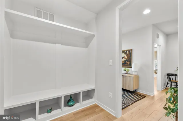 a kitchen with a sink counter top space and stainless steel appliances