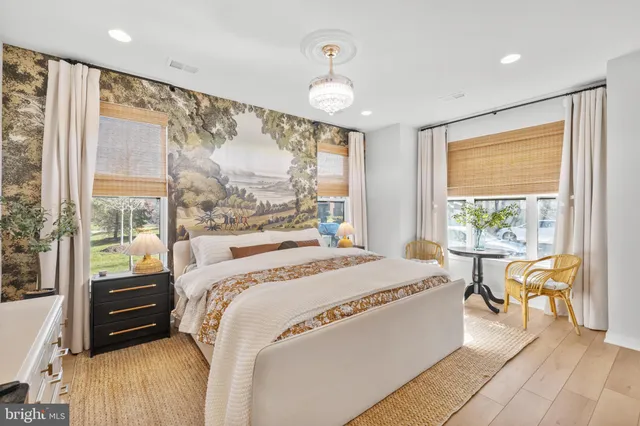 a kitchen with stainless steel appliances granite countertop a stove a sink and a wooden floors