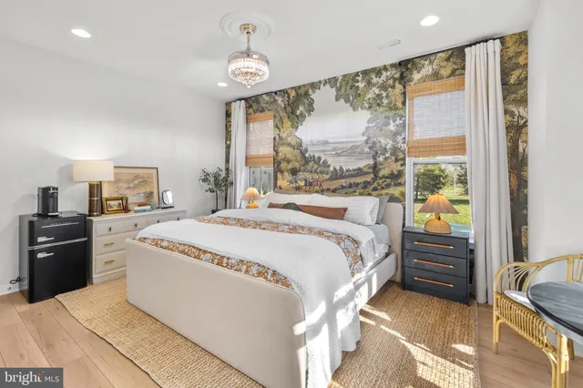 a kitchen with kitchen island granite countertop a sink a counter space and cabinets