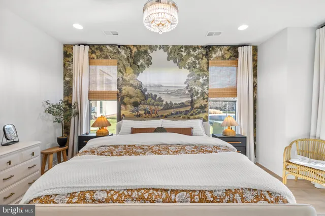 a kitchen with granite countertop a stove and white cabinets