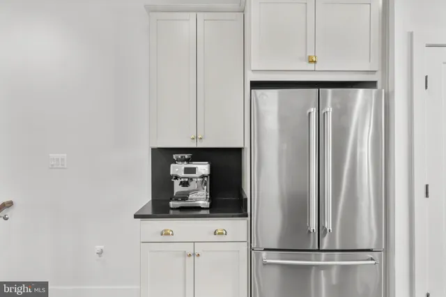 a bedroom with furniture and a flat screen tv