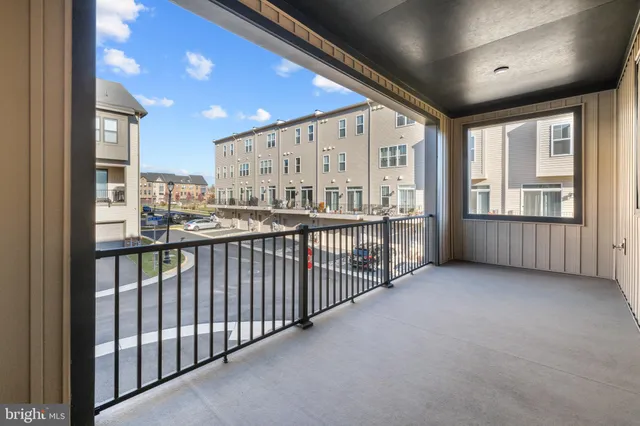 a view of a swimming pool with an outdoor seating