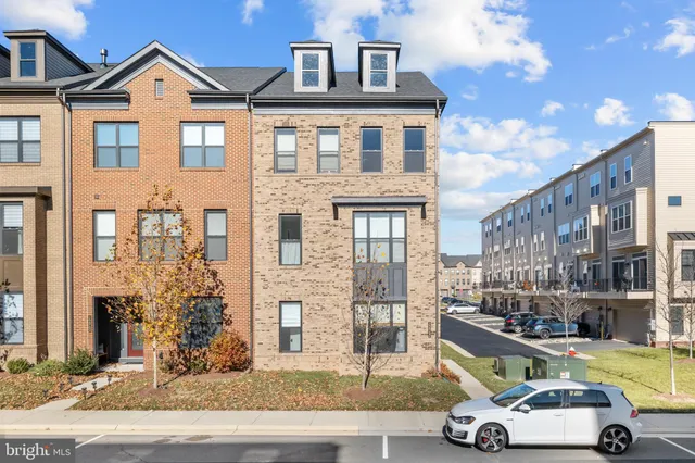 a spacious bedroom with a bed and a large window