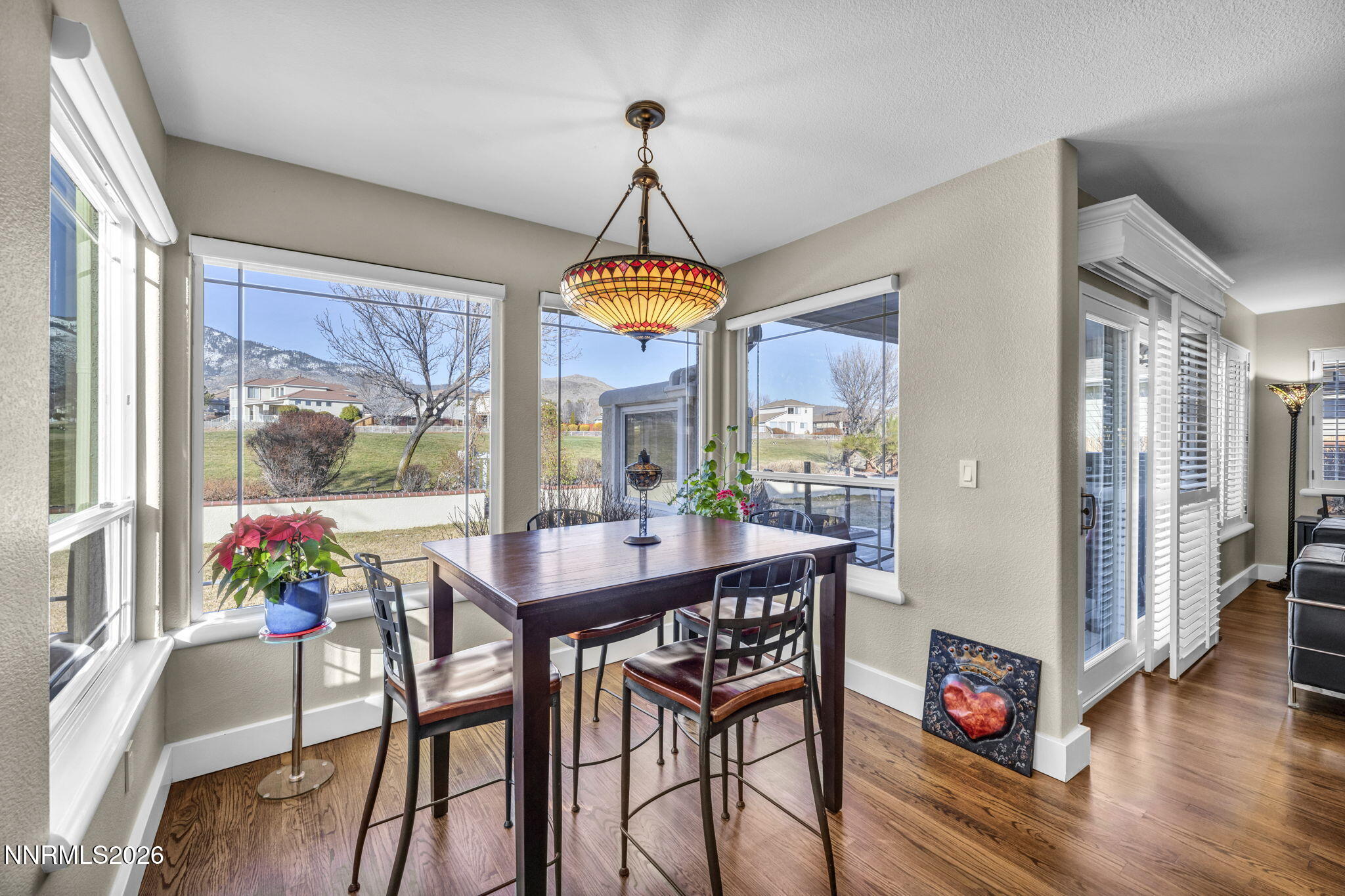 2296 Oak Ridge Drive Carson City, NV 89703 - Photo 24 of 72 a view of a dining room with furniture window and wooden floor