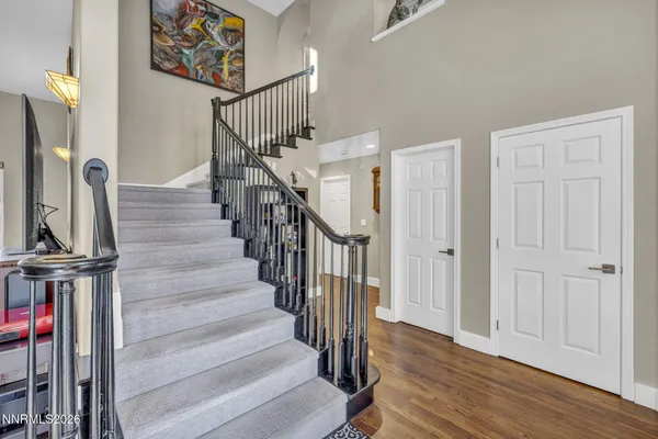a view of a livingroom with furniture and a flat screen tv