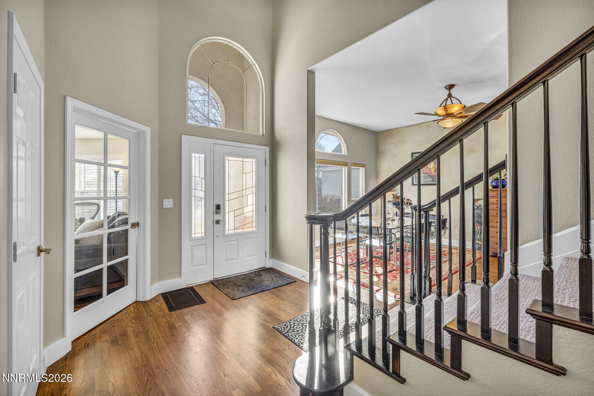 2296 Oak Ridge Drive Carson City, NV 89703 - Photo 32 of 72 a view of entryway with wooden floor and stairs