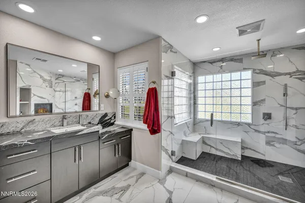 a view of a dinning table and chairs in patio of the house