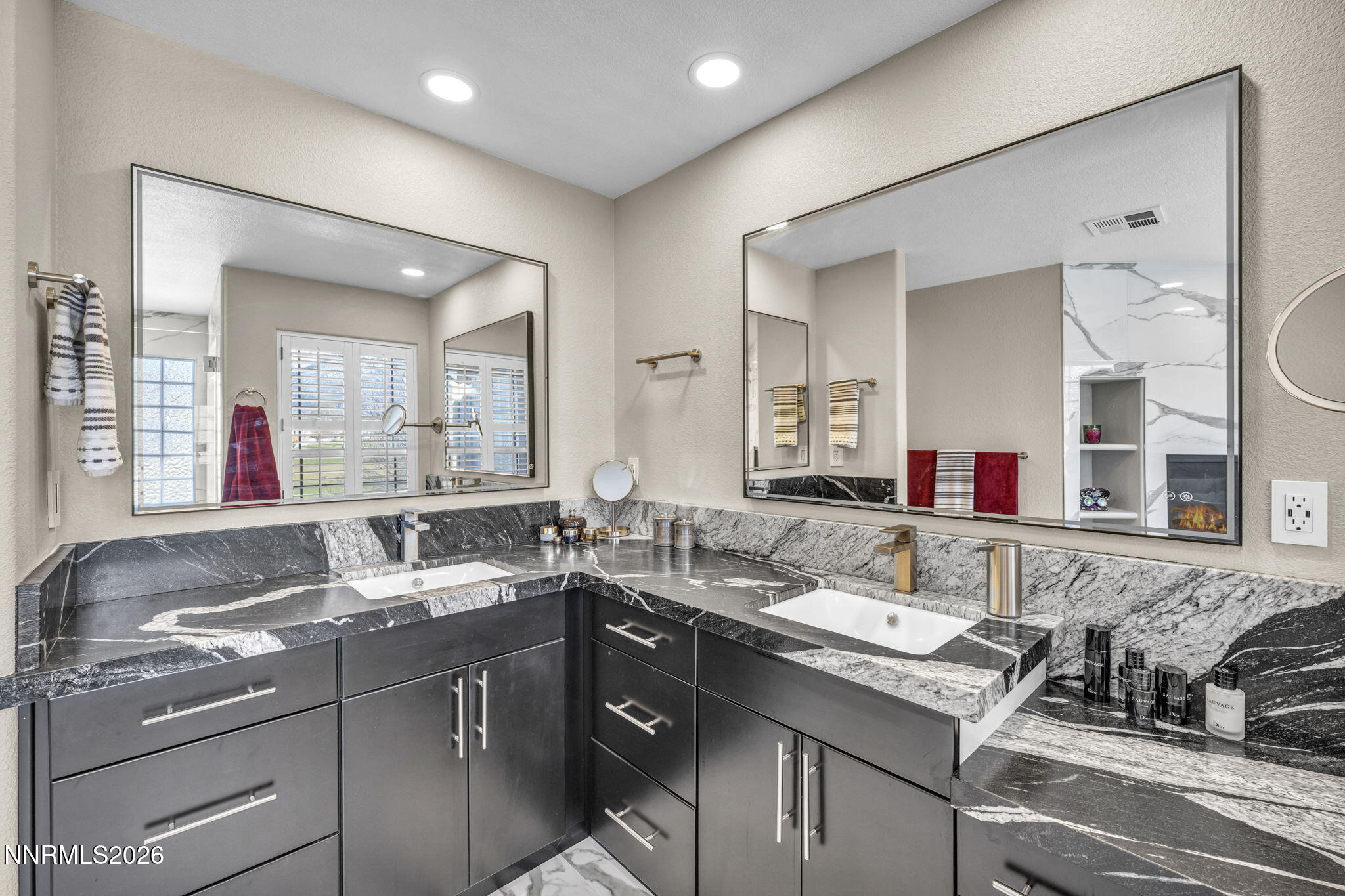 2296 Oak Ridge Drive Carson City, NV 89703 - Photo 43 of 72 a bathroom with a sink and a mirror