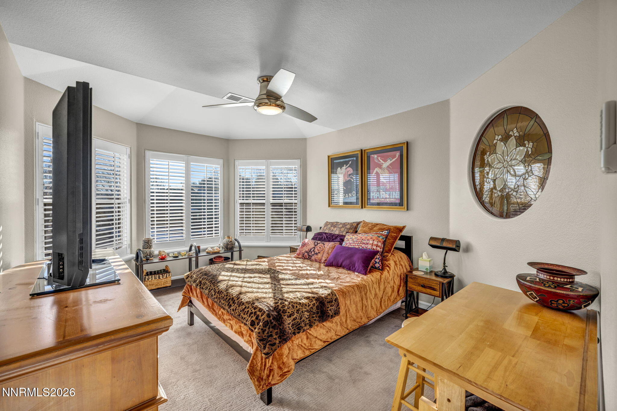 2296 Oak Ridge Drive Carson City, NV 89703 - Photo 46 of 72 a bedroom with two beds and a large mirror next to a window