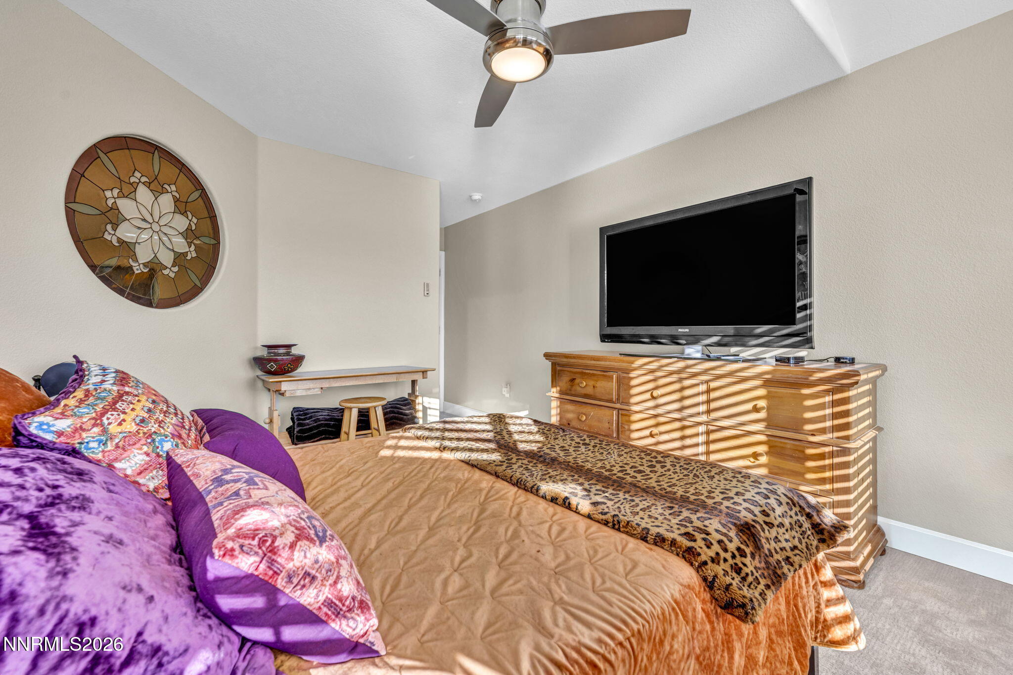 2296 Oak Ridge Drive Carson City, NV 89703 - Photo 47 of 72 a bedroom with a bed and a flat screen tv
